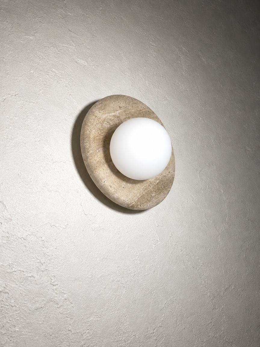 Orba Marble Wall Sconce in Travertine Beige seen from below left