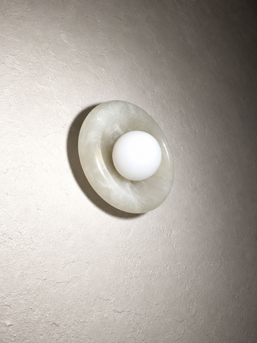 Orba Marble Wall Sconce in White Jade seen from below left
