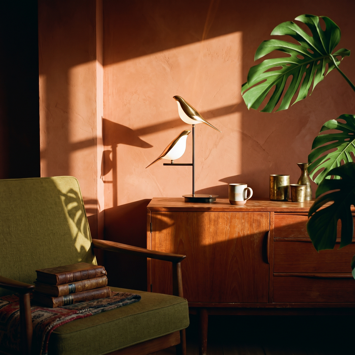 Golden Birdlight Wall Lamp in a lived-in interior
