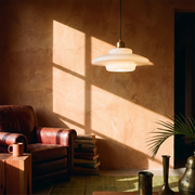 White Glass Pendant Light in a lived-in interior