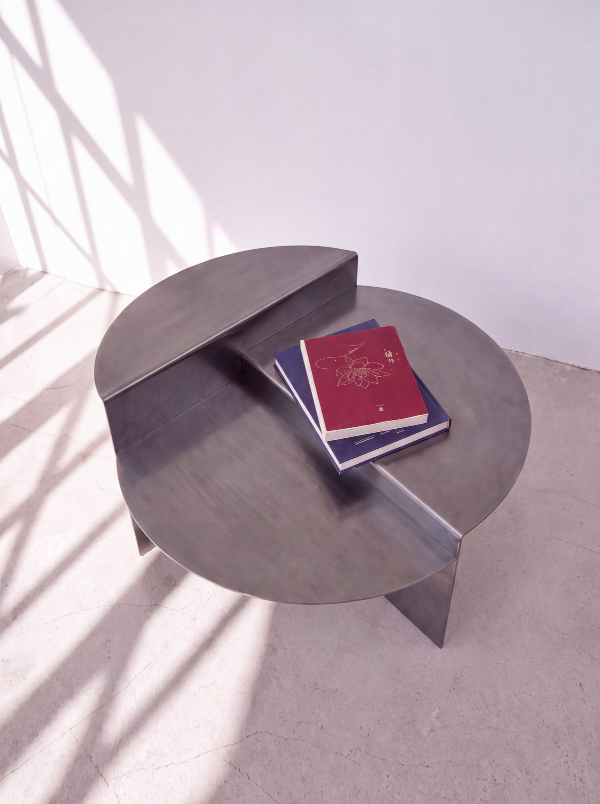 Sana Round Steel Coffee Table — round steel coffee table, three-quarter view from the right