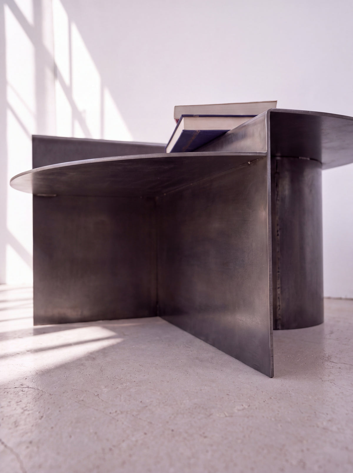 Sana Round Steel Coffee Table — round steel coffee table, low-angle detail