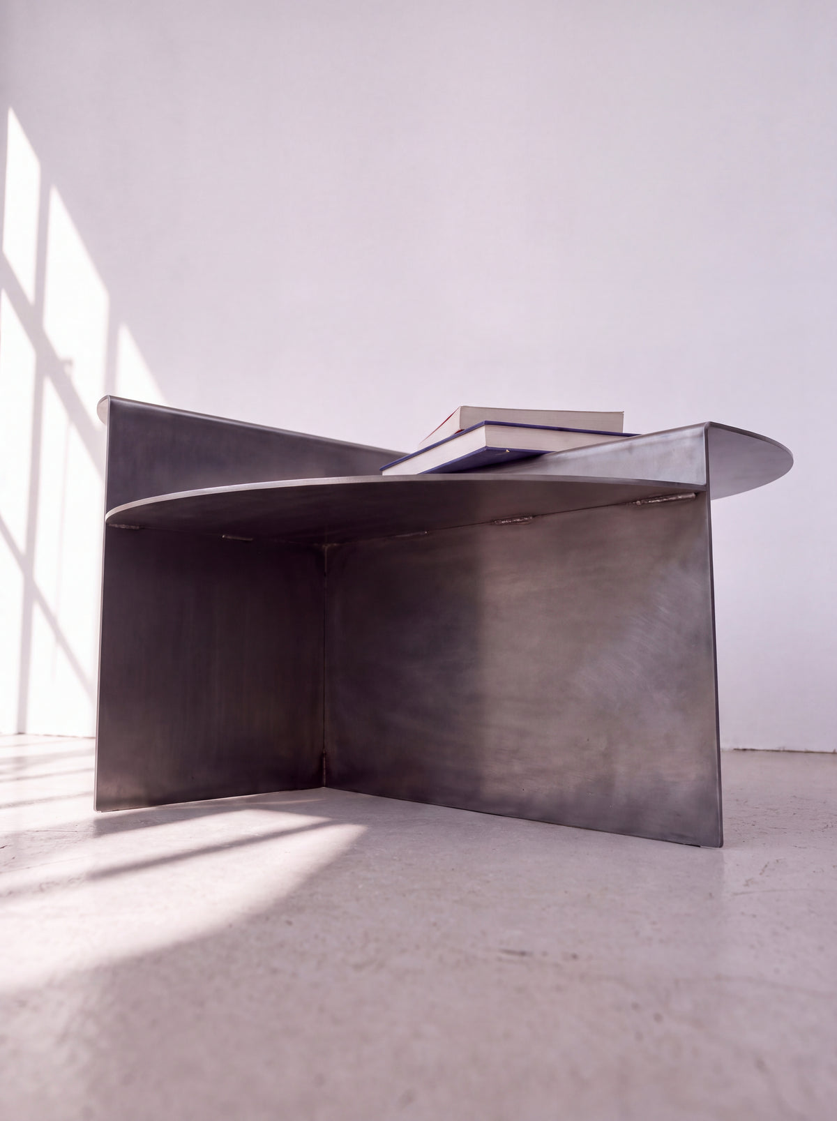 Sana Round Steel Coffee Table — round steel coffee table, low-angle detail